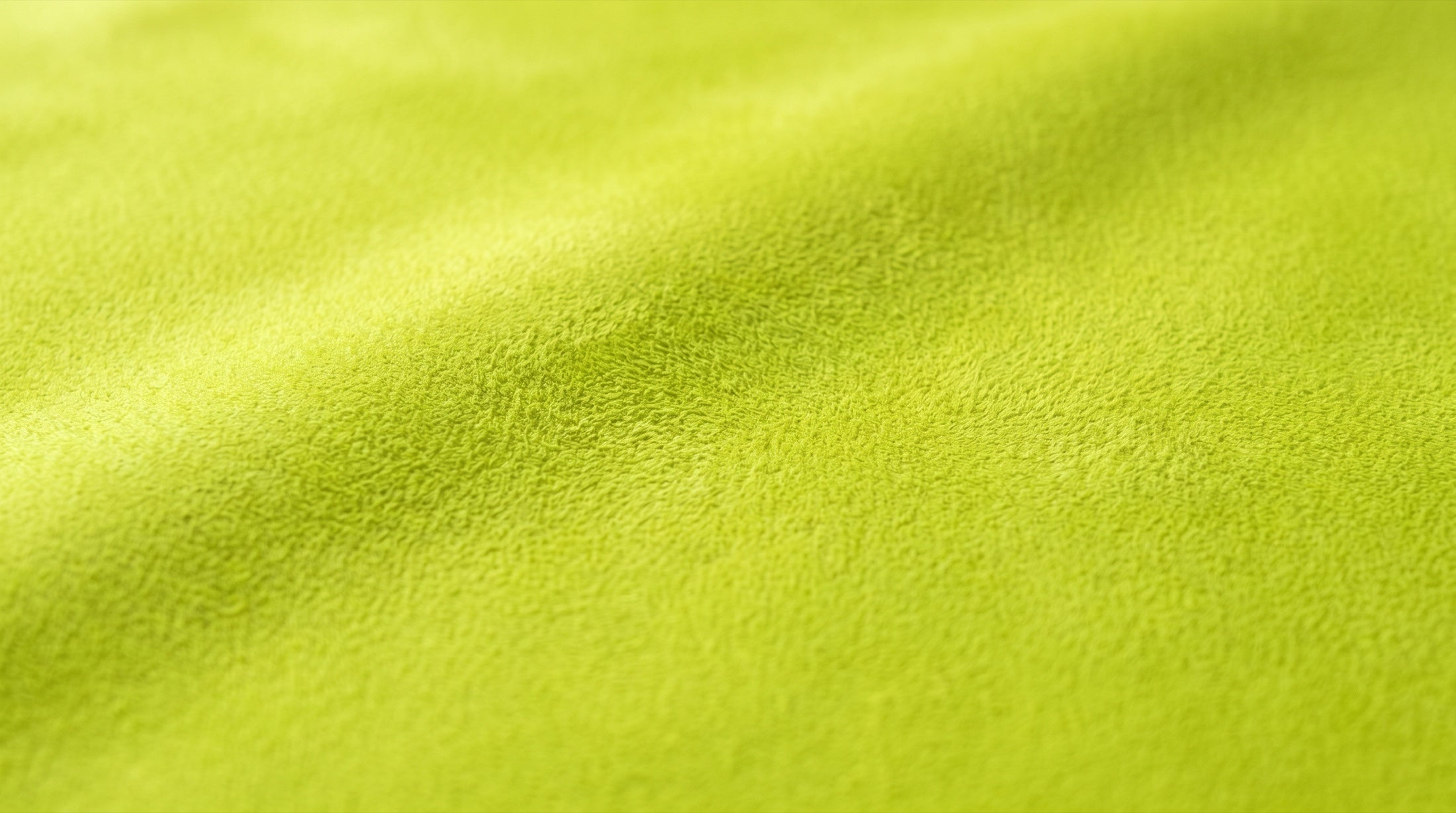 Chartreuse microsuede material swatch — Ovelo's soft-touch finish